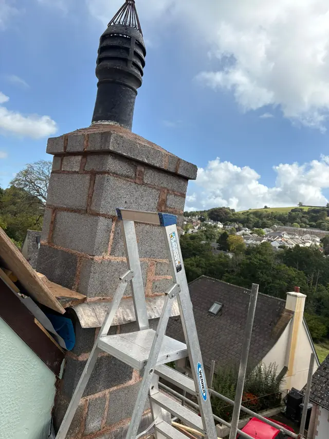 Rebuilt chimney stack with a new lead apron flashing